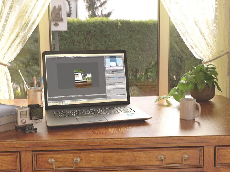 A desktop device on a shelf in a home office