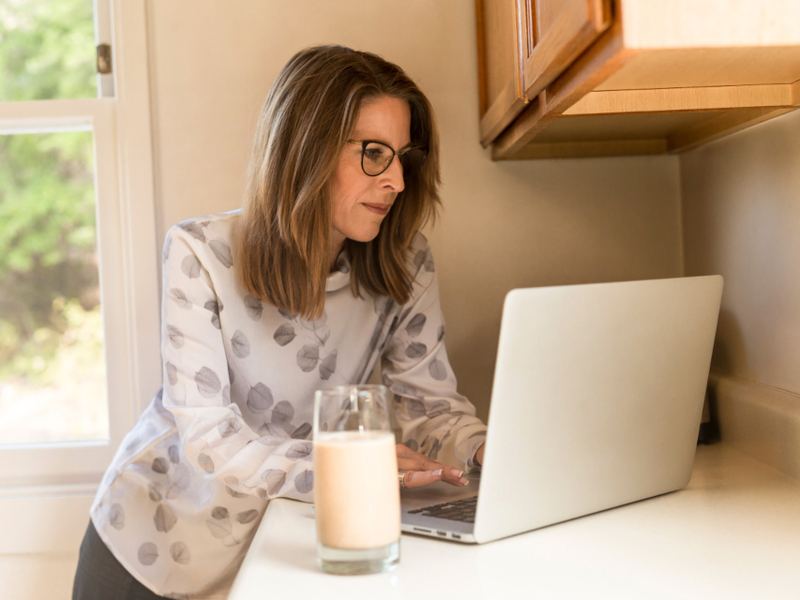 A person working on a laptop at home